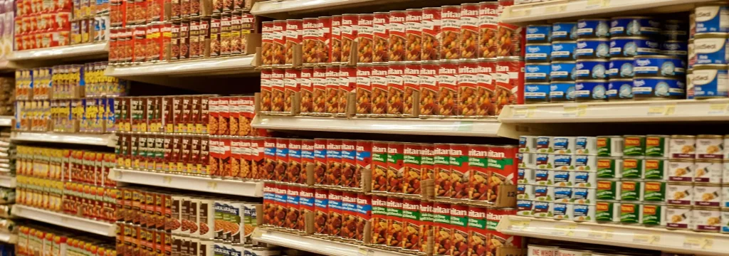 Shelves with cans of pantry foods