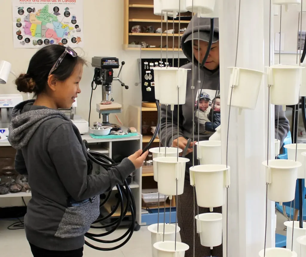 A girl and boy student working and learning with a NutriTower