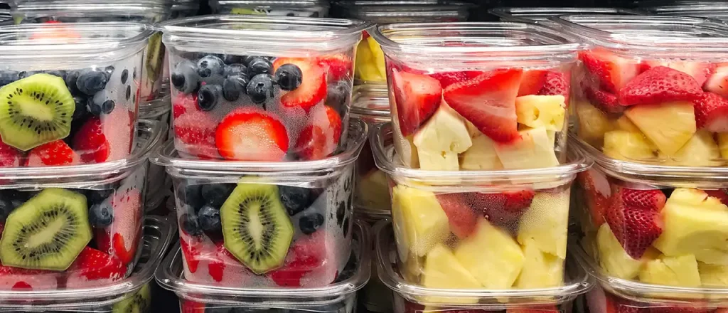 Fresh cut fruits in plastic container