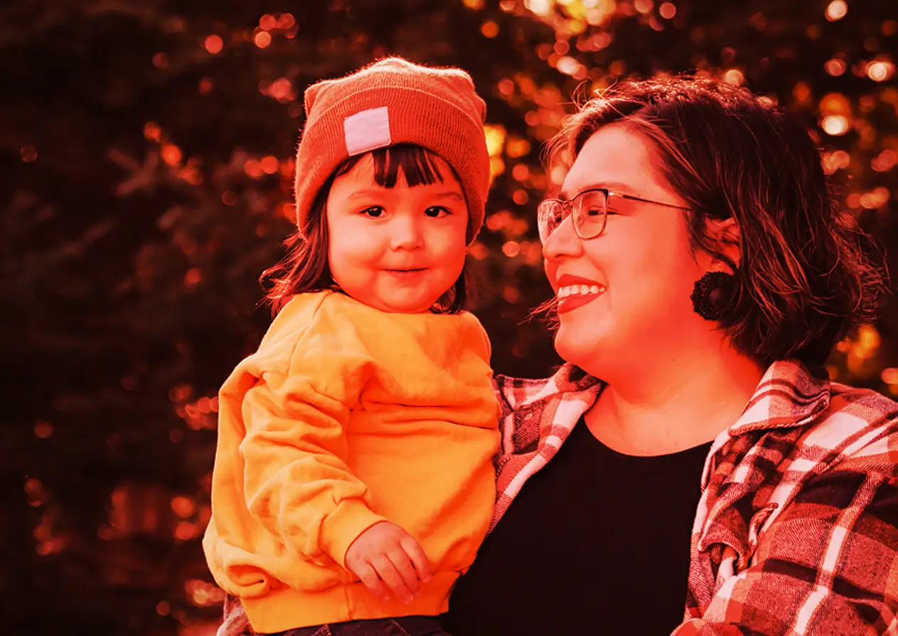 A mother holds her baby