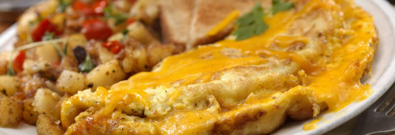 Cheesy Baked Omelette with hash browns on a white plate