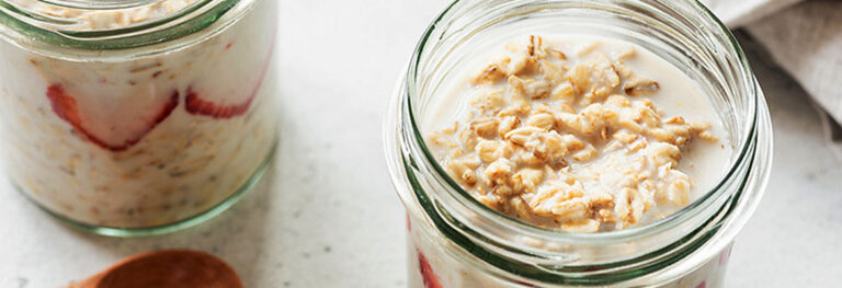 jars of Tropical Overnight Oats on a white table top