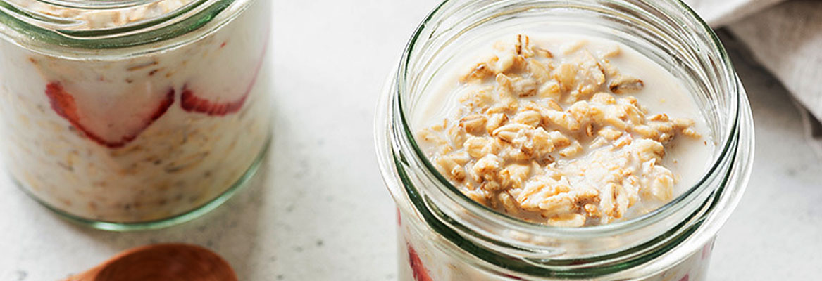 jars of Tropical Overnight Oats on a white table top