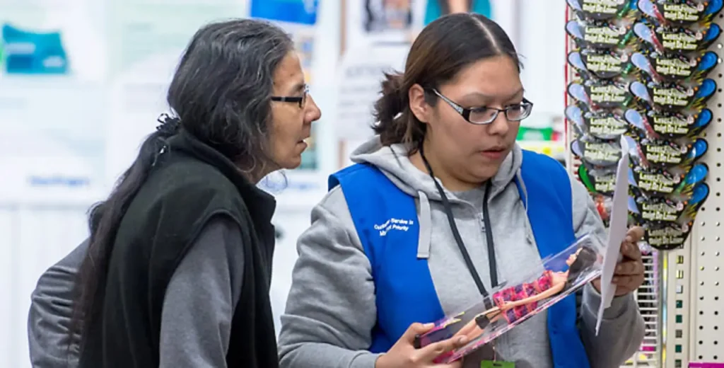 two employees discussing where products go