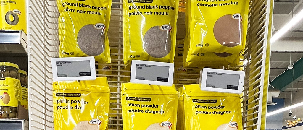 yellow packages of spices hanging on a board