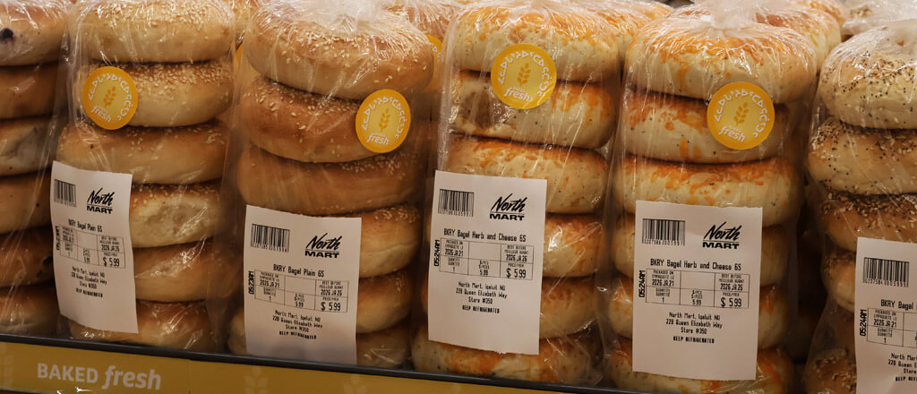 packages of freshly backed bagels on the shelf